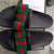 Black Gucci designer slides